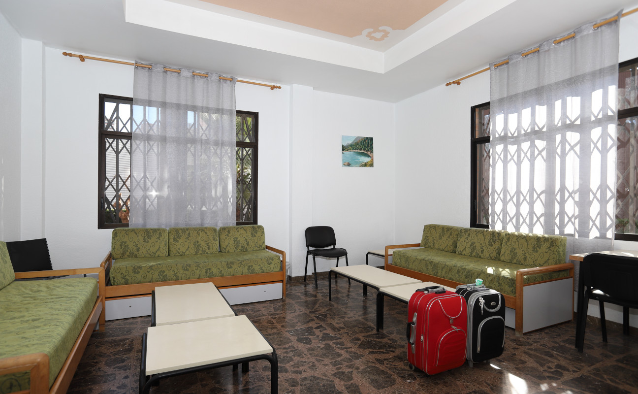 Reception area with a room luggage.